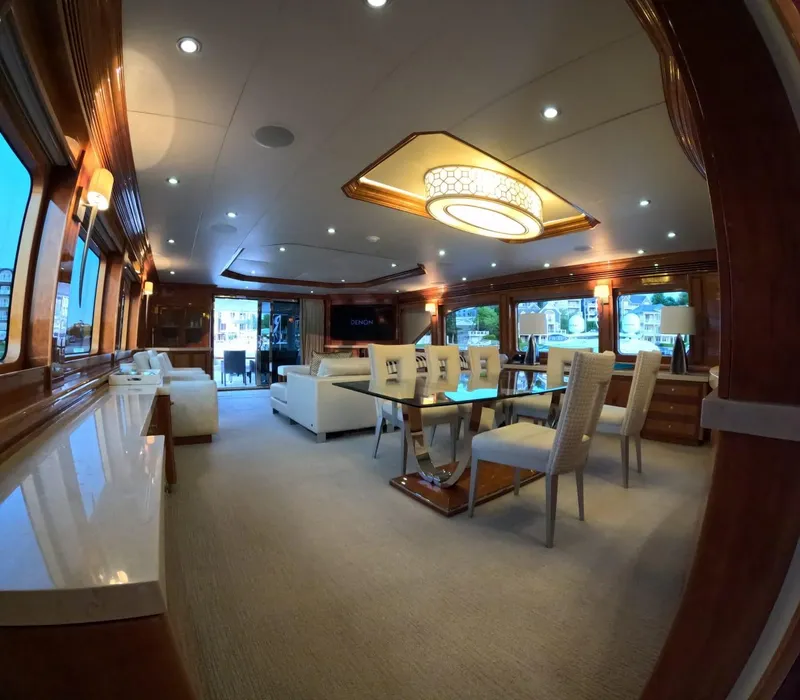 Slide: The Image of Luxurious interior of 2007 Hargrave 93' yacht with elegant dining and seating area. - 20