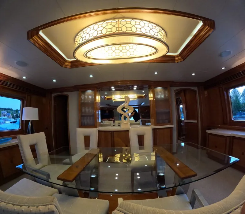 Slide: The Image of Luxurious interior of 2007 Hargrave 93' yacht with elegant dining area and modern lighting. - 21