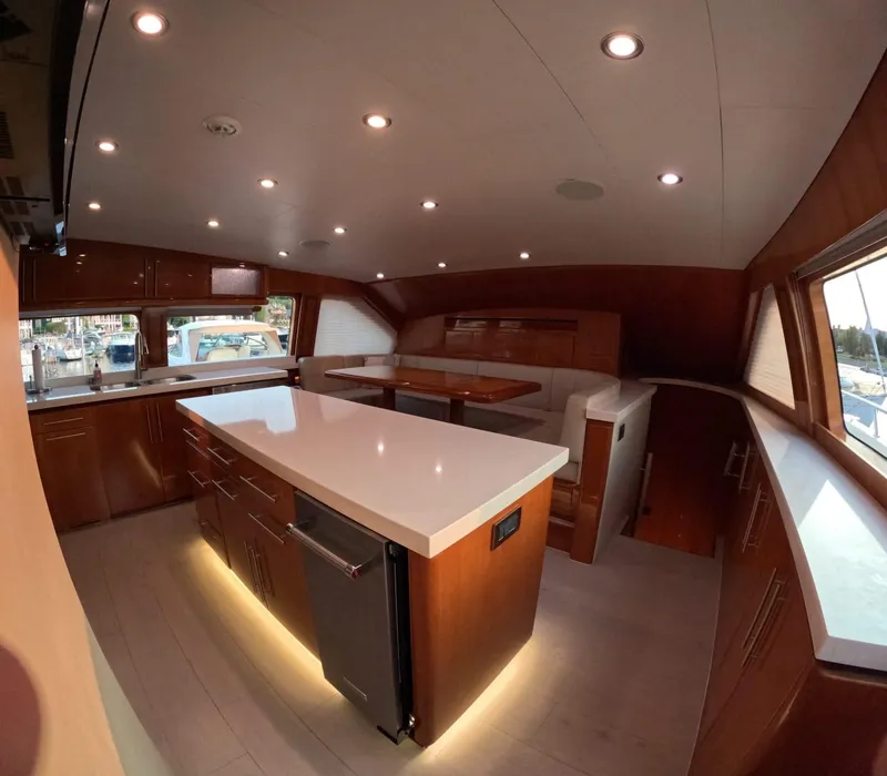 Slide: The Image of Luxurious interior of 2007 Hargrave 93' yacht with modern kitchen and dining area. - 23