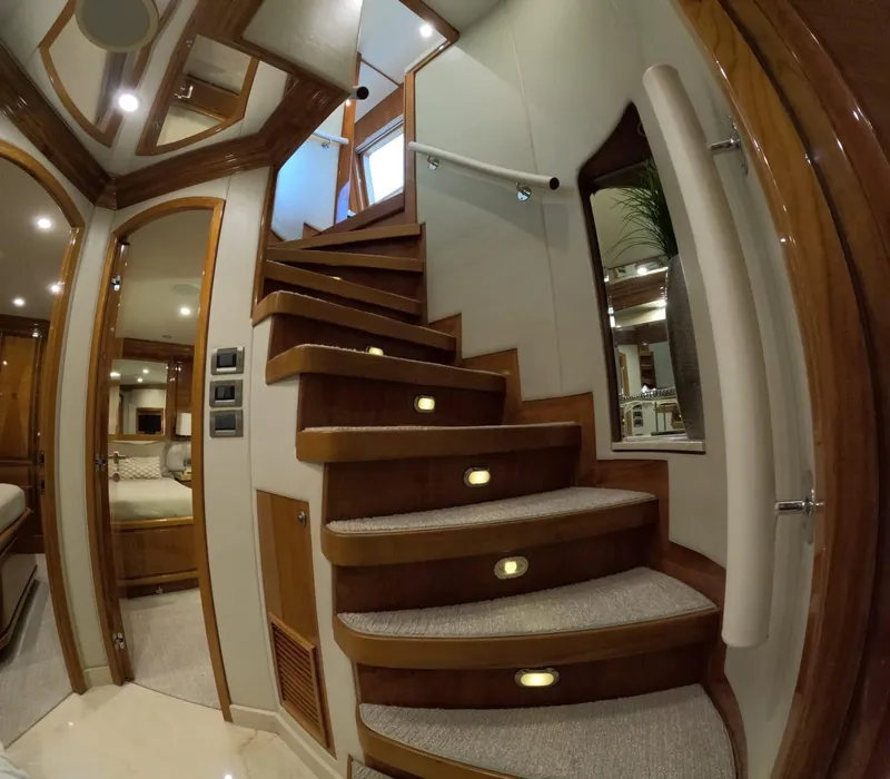 Slide: The Image of Luxurious wooden staircase inside 2007 Hargrave 93' yacht, featuring elegant lighting and modern design. - 29
