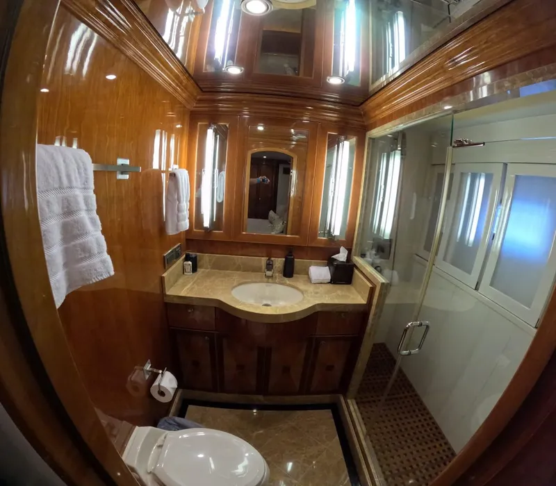 Slide: The Image of Luxurious bathroom in 2007 Hargrave 93' yacht with wood paneling and modern fixtures. - 30
