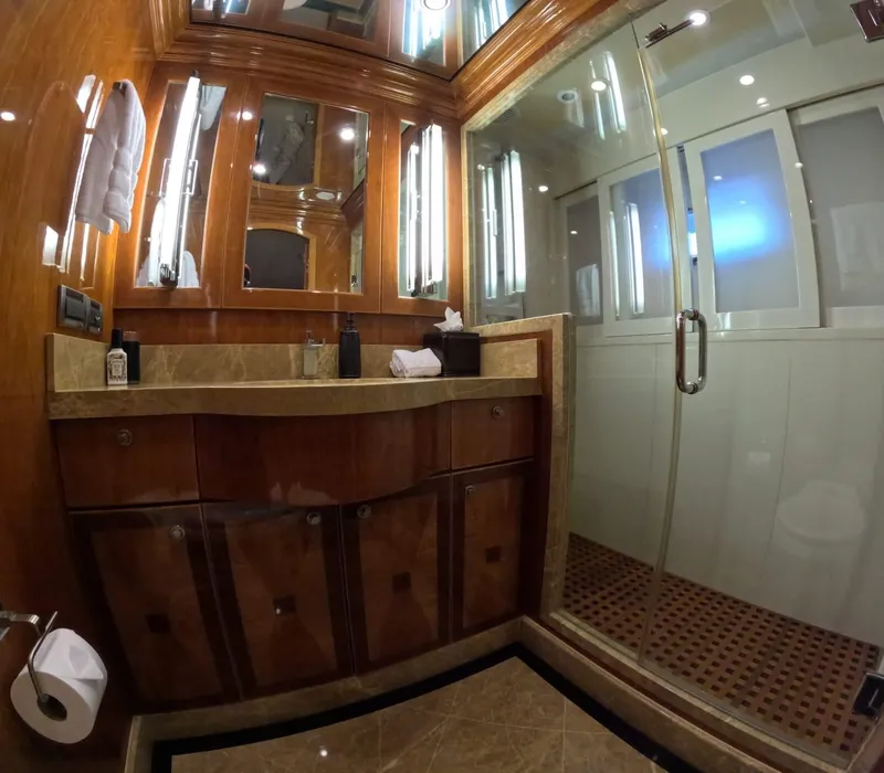 Slide: The Image of Luxurious bathroom on 2007 Hargrave 93' yacht with glass shower and elegant wood finishes. - 33