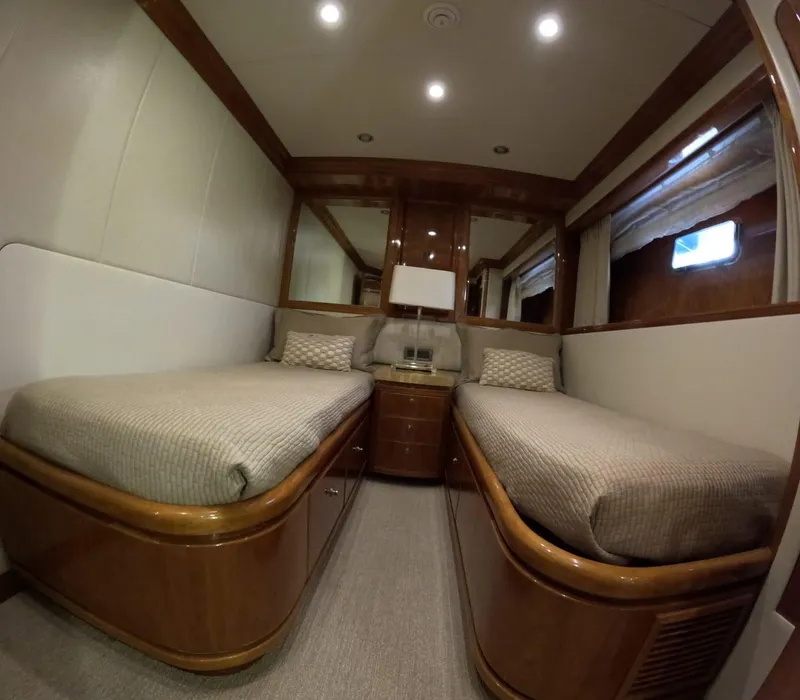 Slide: The Image of Luxurious twin cabin interior on 2007 Hargrave 93' yacht, featuring elegant wood finishes. - 34