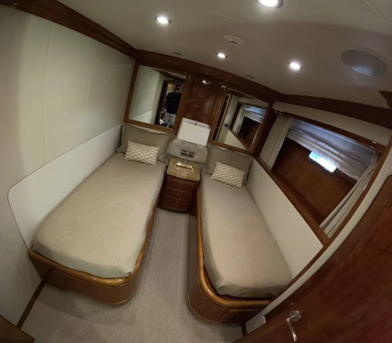 Slide: The Image of Luxurious twin cabin interior of 2007 Hargrave 93' yacht with elegant wood finishes. - 35