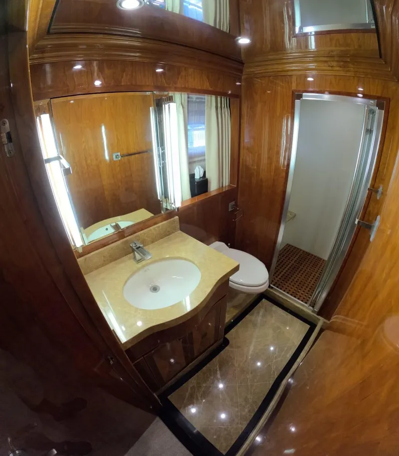 Slide: The Image of Luxurious bathroom in 2007 Hargrave 93' yacht with wood accents and modern fixtures. - 36