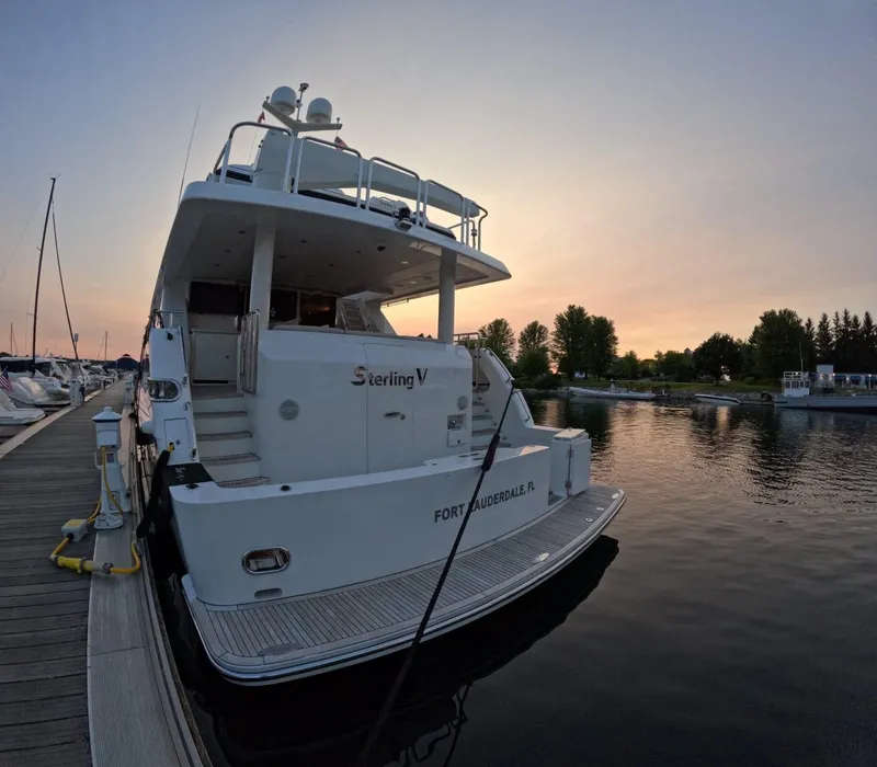 Slide: The Image of Luxury Hargrave yacht docked at sunset, 2007 model, serene waterfront view. - 8