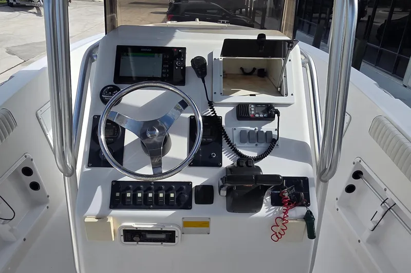 Slide: The Image of Helm console of a 2008 Clearwater 2300 Center Console boat. - 19