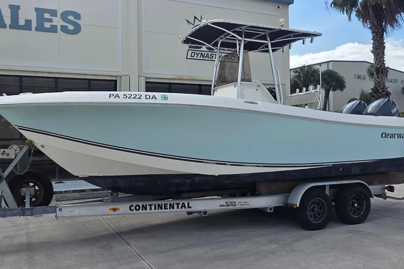 Slide: The Image of 2008 Clearwater 2300 Center Console on trailer in front of building. - 3