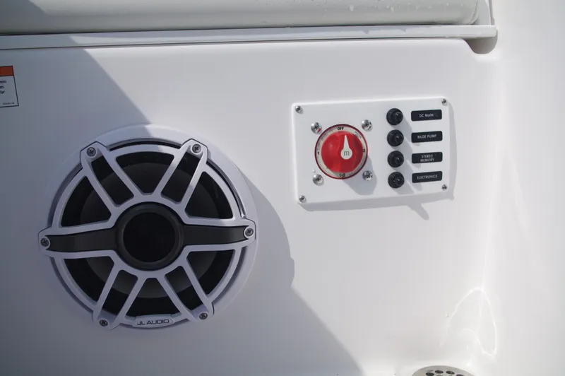 Slide: The Image of Speaker and controls on Everglades 235 Center Console 2023. - 10