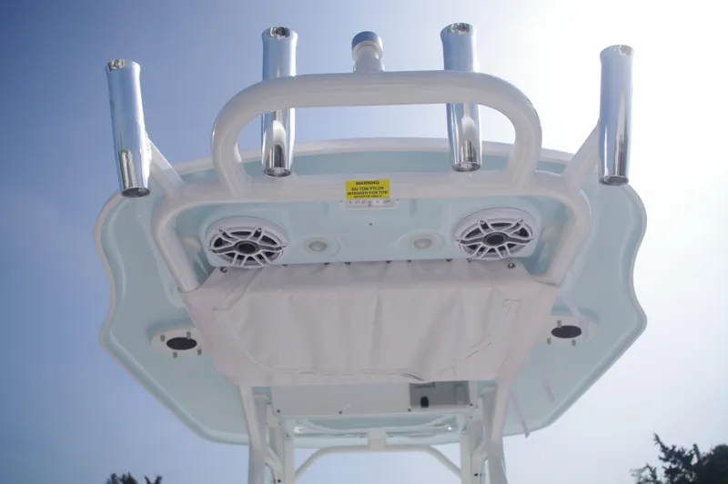 Slide: The Image of Everglades 235 Center Console 2023 with speakers and rod holders. - 21