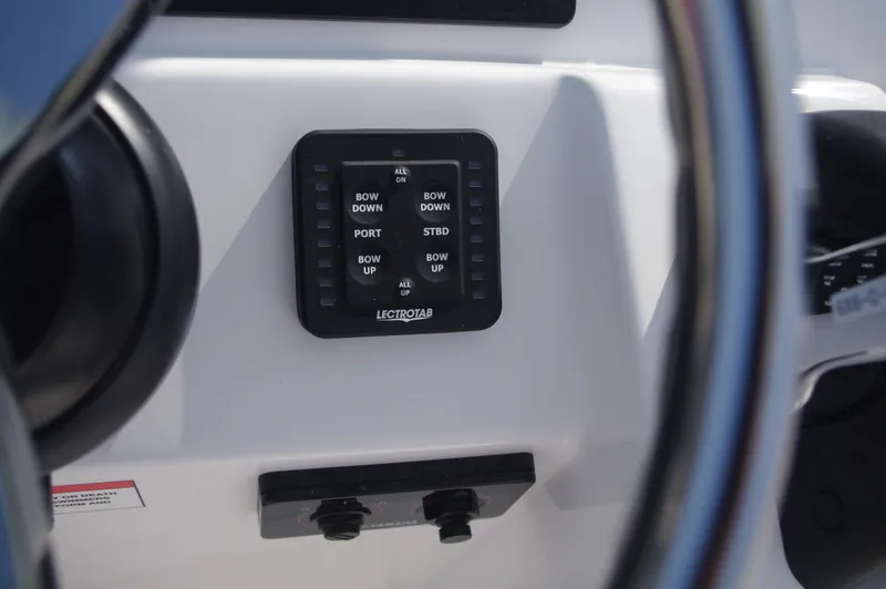 Slide: The Image of Control panel of 2023 Everglades 235 Center Console with controls. - 28