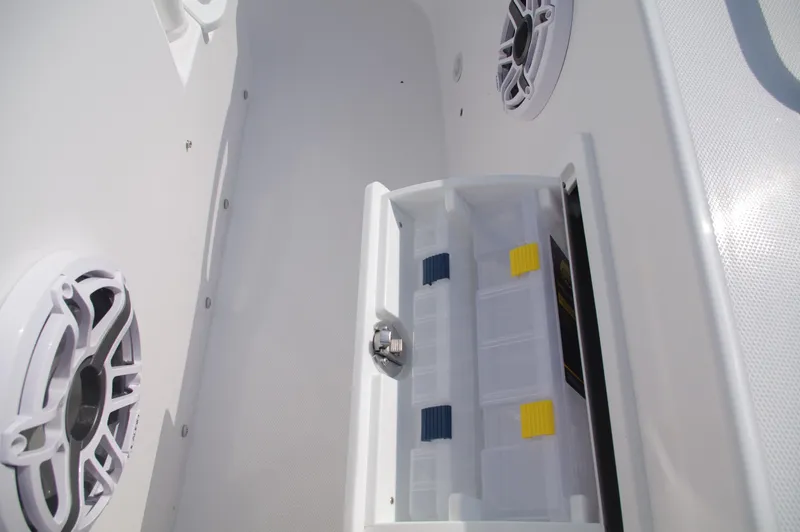 Slide: The Image of Interior view of 2023 Everglades 235 Center Console with speakers and storage. - 34