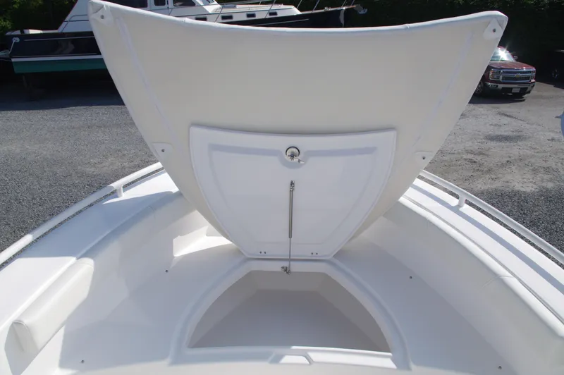 Slide: The Image of Everglades 235 Center Console 2023 with open storage compartment lid. - 37