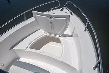 Slide: The Image of Everglades 235 Center Console 2023 with open bow storage compartment. - 43