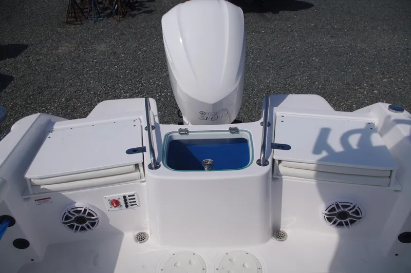 Slide: The Image of 2023 Everglades 235 Center Console boat stern view with engine. - 6
