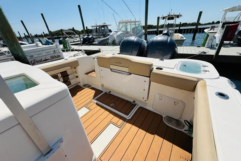 Slide: The Image of Interior view of a 2021 NauticStar 28 XS boat at the dock. - 8