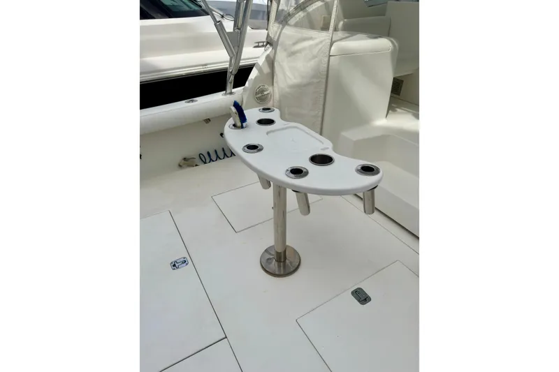 Slide: The Image of Fishing rod holder on 2004 Topaz 32 Express boat deck. - 13