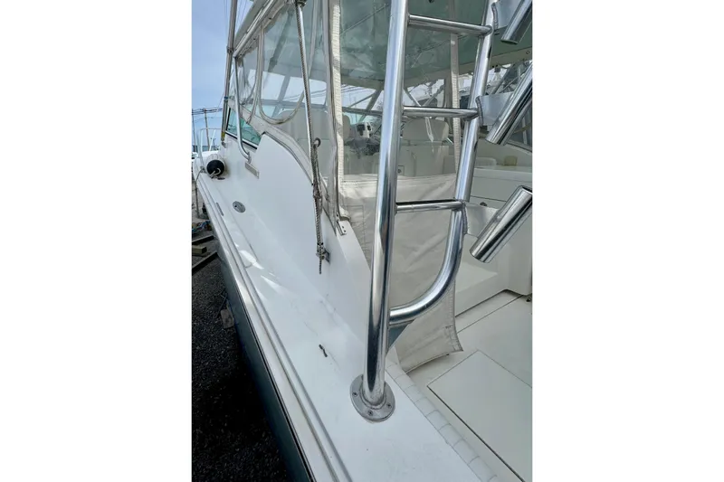 Slide: The Image of 2004 Topaz 32 Express with stainless steel ladder and enclosed cockpit. - 37