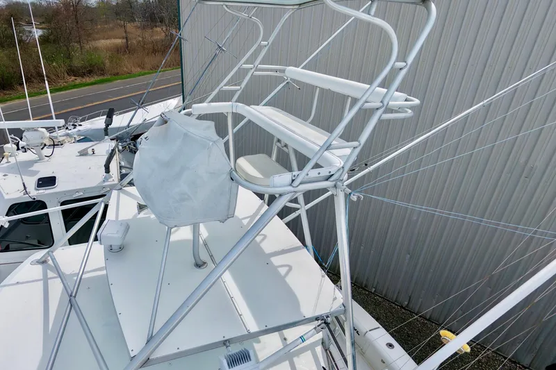 Slide: The Image of 2004 Topaz 32 Express boat with elevated helm station - 5