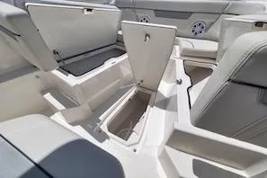 Slide: The Image of 2027 Sailfish 252 CC boat interior with open storage compartments. - 13