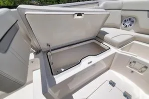 Slide: The Image of 2027 Sailfish 252 CC boat interior with open storage compartment and seating area. - 14
