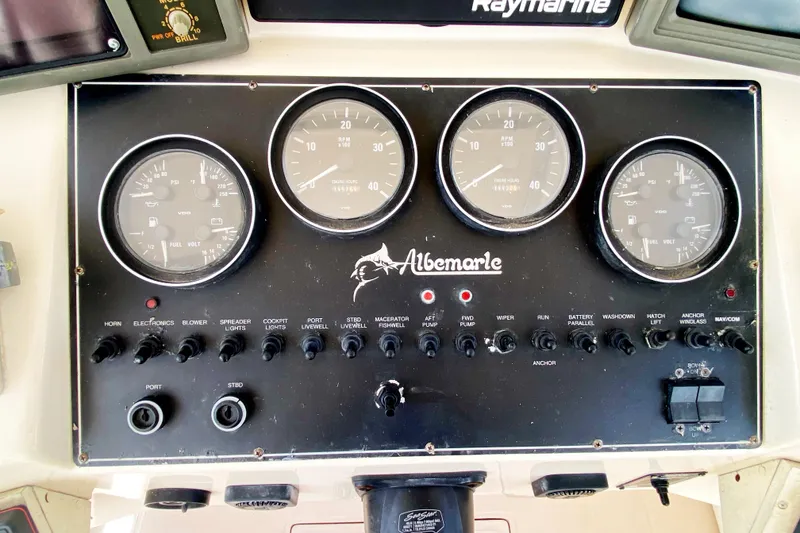 Slide: The Image of Instrument panel of a 1997 Albemarle 30 Express boat with gauges and controls. - 17
