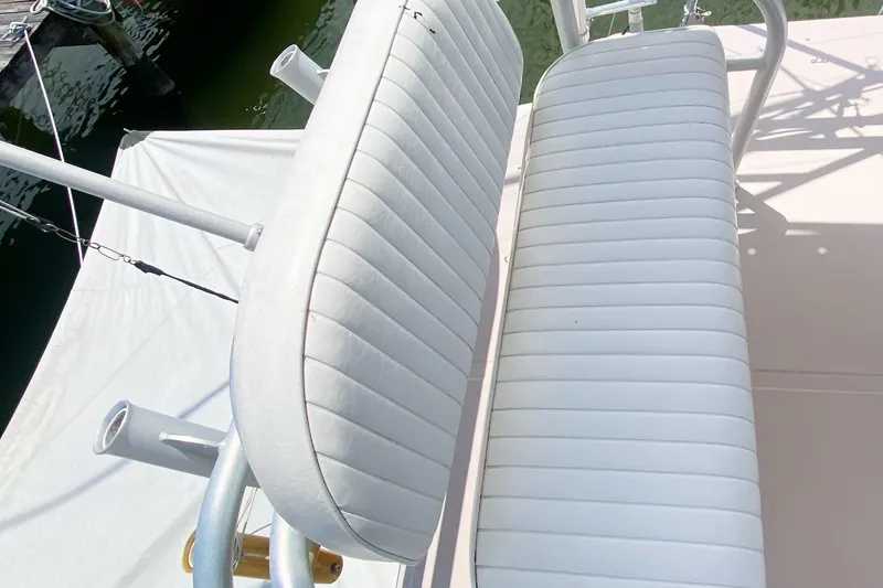 Slide: The Image of White cushioned seats on a 1997 Albemarle 30 Express boat deck. - 19