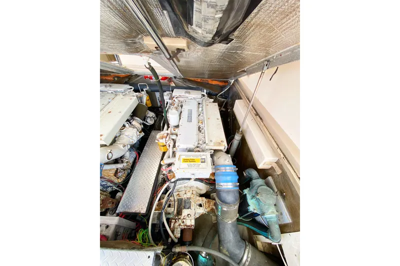 Slide: The Image of Engine compartment of a 1997 Albemarle 30 Express boat, showcasing mechanical components. - 34