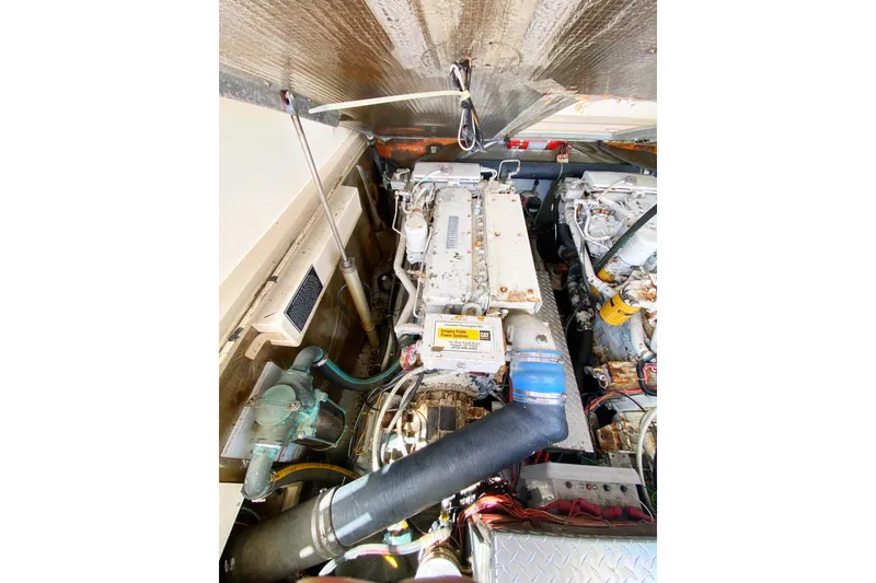 Slide: The Image of Engine compartment of a 1997 Albemarle 30 Express boat, showcasing mechanical components. - 35