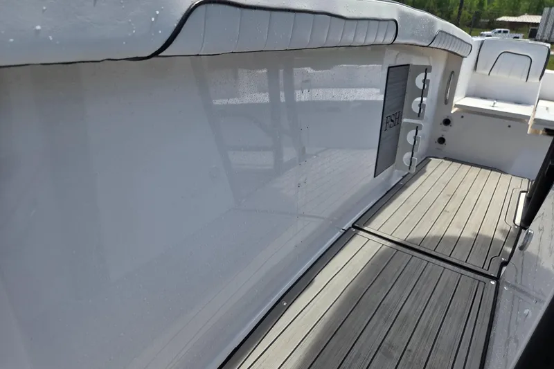 Slide: The Image of Yamaha Boats 255 FSH Sport E 2023, interior view with wood deck. - 15