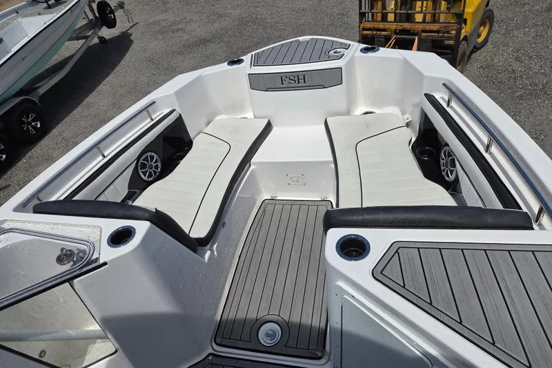 Slide: The Image of Yamaha Boats 2023 255 FSH Sport E interior view with seating area. - 18