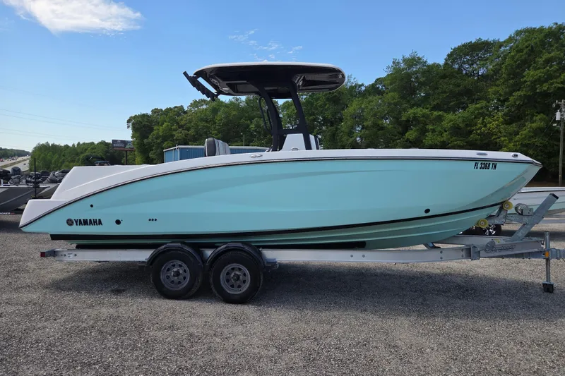Slide: The Image of 2023 Yamaha Boats 255 FSH Sport E on trailer, side view. - 3
