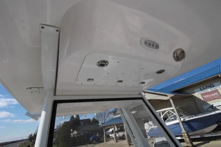 Slide: The Image of 2026 Sea Fox 228 Commander boat interior ceiling with controls and speaker. - 12