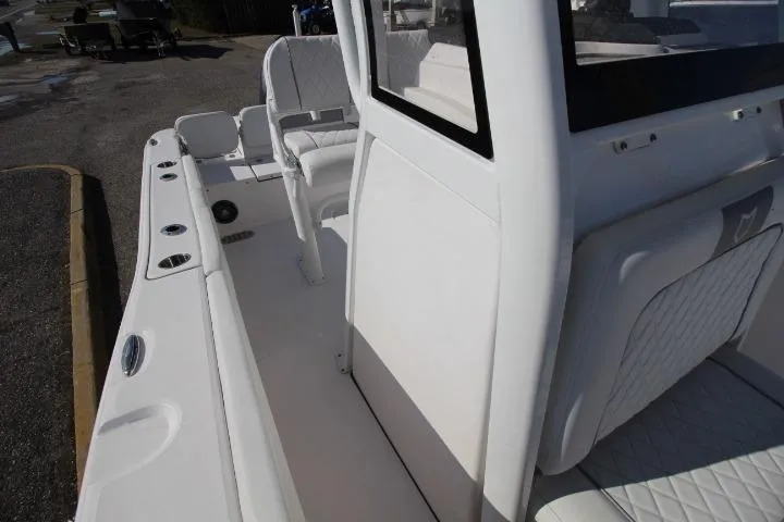Slide: The Image of 2026 Sea Fox 228 Commander boat interior with white seating and console. - 13