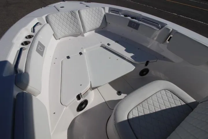 Slide: The Image of 2026 Sea Fox 228 Commander boat interior with cushioned seating and storage compartments. - 14