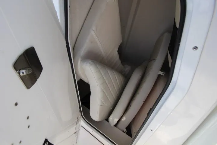Slide: The Image of Storage compartment with white cushions in a 2026 Sea Fox 228 Commander boat. - 19