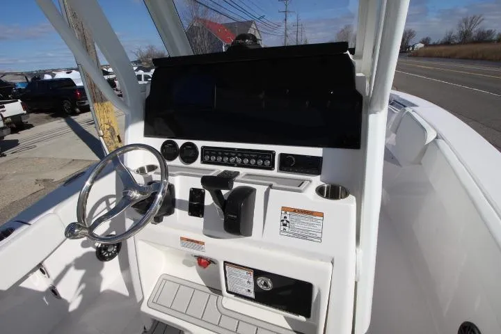 Slide: The Image of 2026 Sea Fox 228 Commander boat dashboard with steering wheel and control panel. - 20