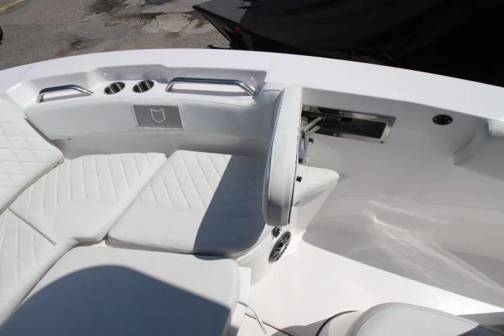 Slide: The Image of Interior view of 2026 Sea Fox 228 Commander boat with white seating and cup holders. - 21