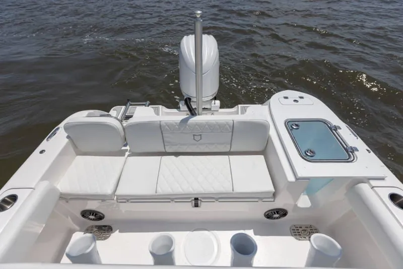 Slide: The Image of Manufacturer Provided Image: 2025 Sea Fox 228 Commander boat interior with seating and storage on water. - 23