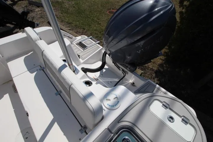 Slide: The Image of 2026 Sea Fox 228 Commander boat interior with engine and seating area. - 7