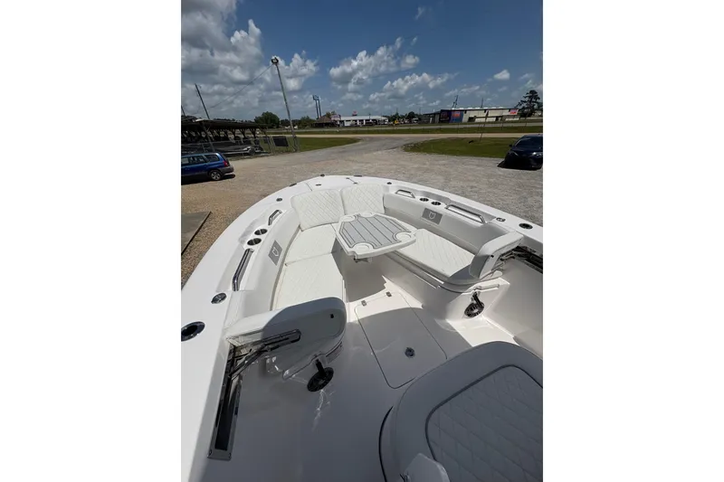 Slide: The Image of 2026 Sea Fox 248 Commander boat interior with open storage compartments and cushioned seating. - 10