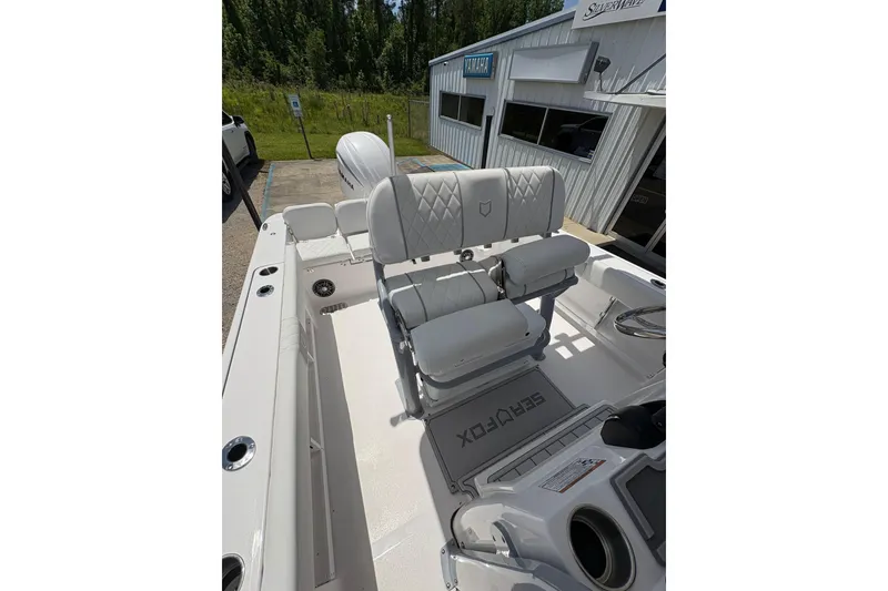 Slide: The Image of 2026 Sea Fox 248 Commander boat interior with seating and storage compartments. - 11