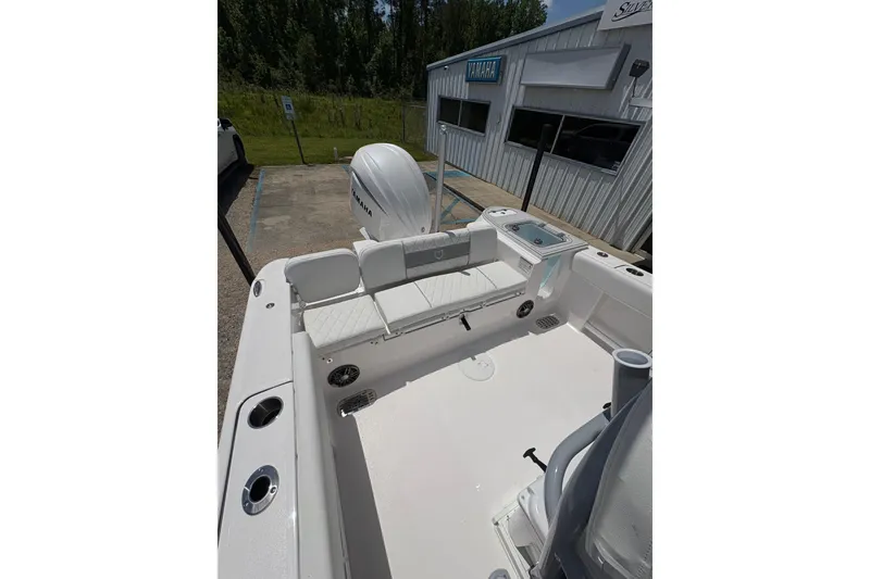 Slide: The Image of 2026 Sea Fox 248 Commander boat interior with open door revealing compact marine toilet. - 13