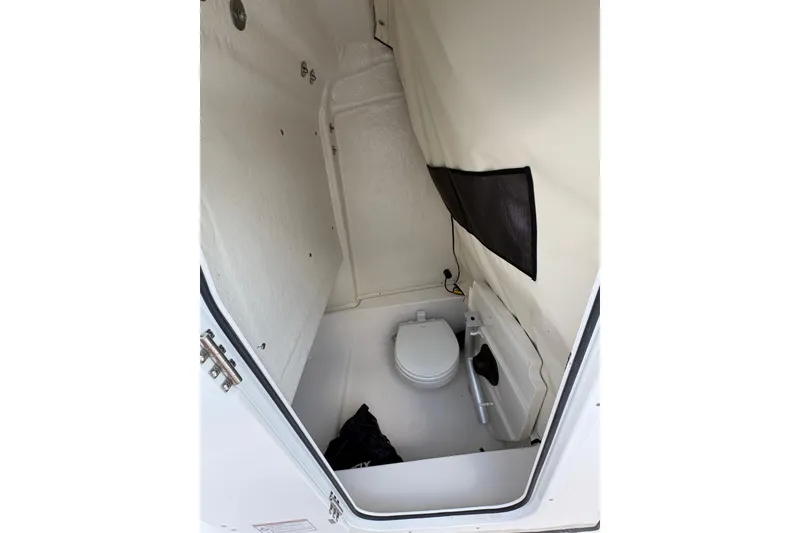 Slide: The Image of 2026 Sea Fox 248 Commander boat on trailer with Yamaha engine under cloudy sky. - 5