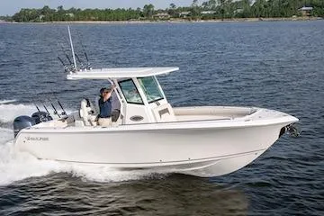 The Image of 2027 Sailfish 272 CC boat cruising on a calm lake. - 1