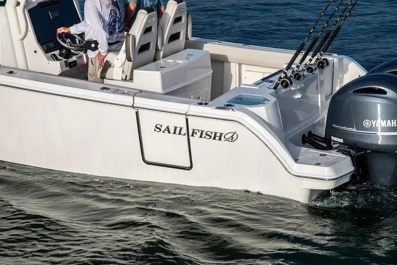 Slide: The Image of 2027 Sailfish 272 CC boat with Yamaha engines, featuring fishing rods and spacious seating. - 5