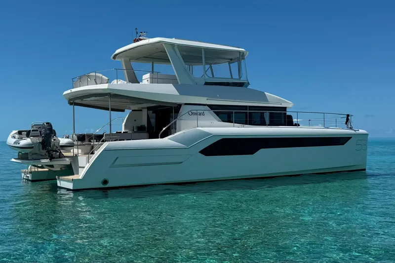 The Image of 2021 Leopard 53 Powercat yacht on clear turquoise water under blue sky. - 0