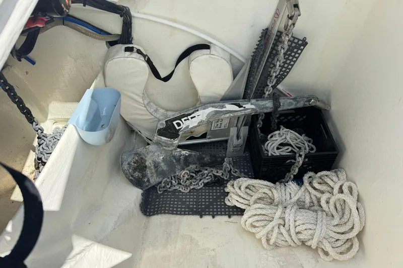 Slide: The Image of Storage compartment of 2021 Leopard 53 Powercat with anchor, ropes, and life jacket. - 10