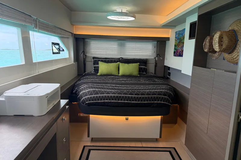 Slide: The Image of Luxurious bedroom interior of 2021 Leopard 53 Powercat yacht with modern decor and ocean view. - 2