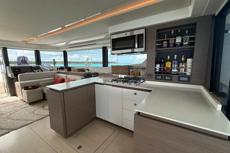 Slide: The Image of Luxurious interior of 2021 Leopard 53 Powercat yacht with modern kitchen and seating area. - 3